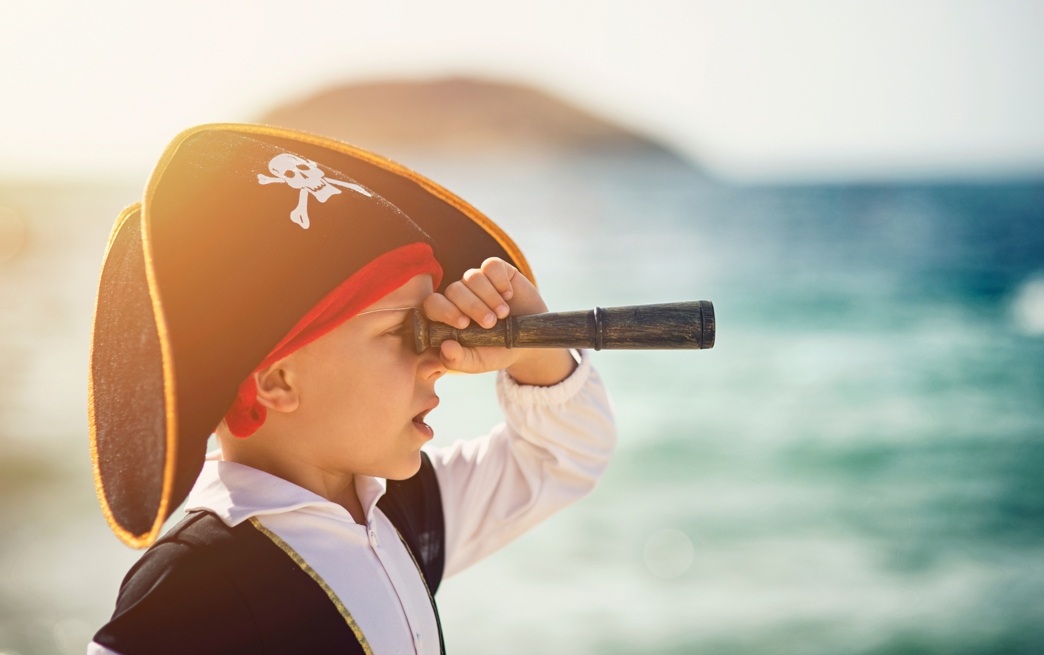 Little pirate looking with spyglass